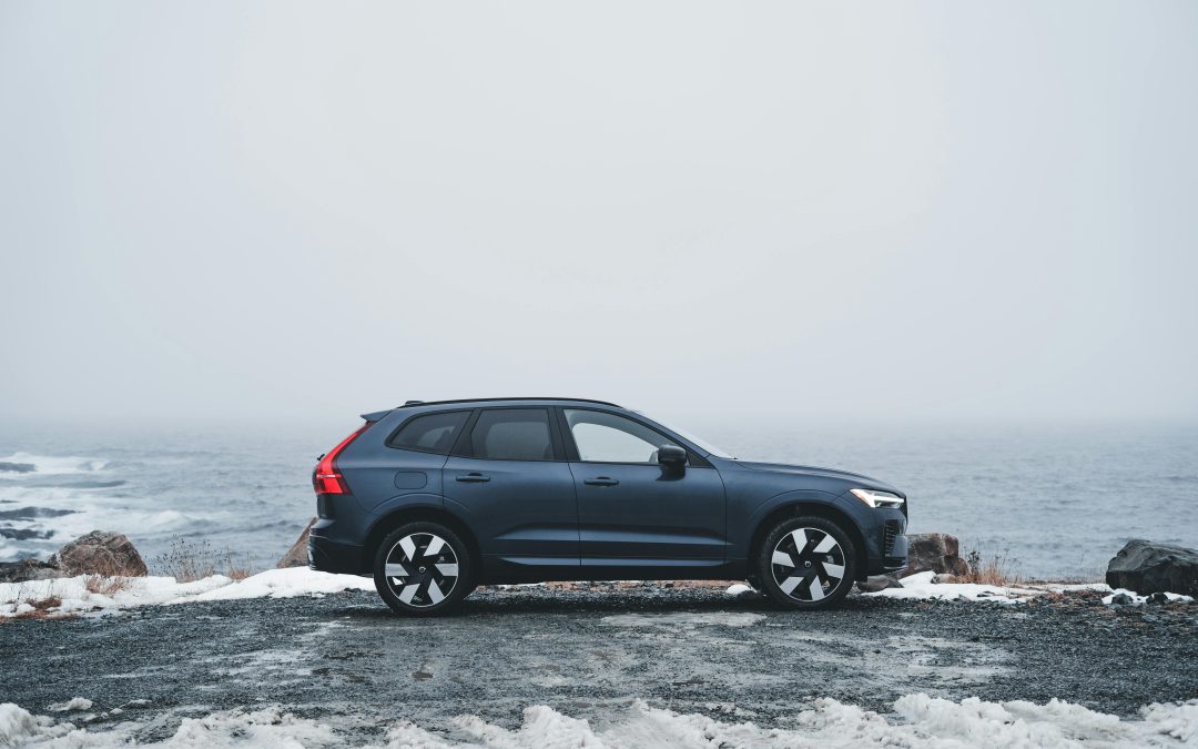 Blue Car that may have been shipped to alaska due to the snowy weather pictured